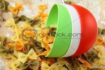 uncooked tricolor pasta in cups in the style of the Italian flag