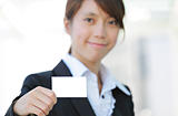 business woman showing blank card