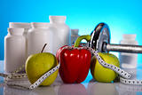 Apple with measuring of dumbbell