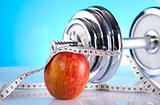 Apple with measuring of dumbbell