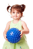 Happy toddler girl with ball