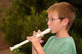 Boy playing a recorder