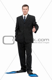 man in a business suit and flippers for swimming