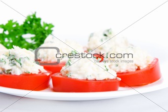 Sliced tomato with cheese and garlic sauce