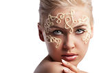 blonde girl with a wool string on her face