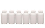 white pills containers in a row isolated on white