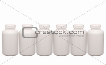 white pills containers in a row isolated on white