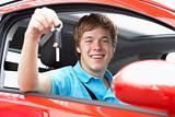 Teenage Boy Sitting In Car Holding Car Keys