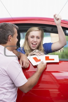 Teenage Girl Receiving Her Learner Plates