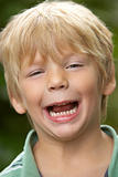 Portrait Of Young Boy Laughing