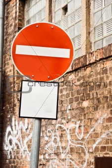 Prohobition traffic sign against abandoned industrial background