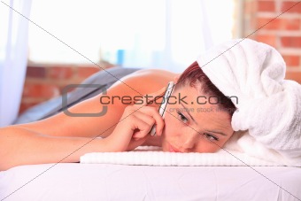 Woman getting a massage on a cell phone