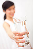 Asian Chinese Girl Holding Glass of Pure Water to Camera