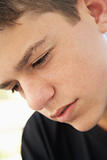 Portrait Of Teenage Boy Looking Upset