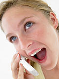 Portrait Of Teenage Girl Smiling And Talking On Cellphone