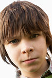 Portrait Of Boy Frowning