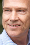 Portrait Of Middle Aged Man Smiling Happily