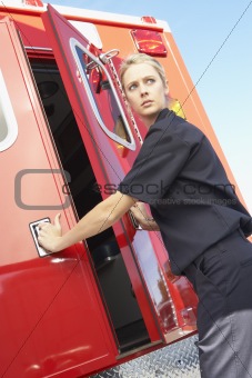 Paramedic closing ambulance doors