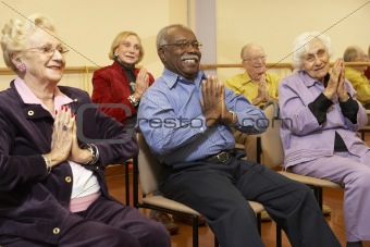 Senior adults in a stretching class