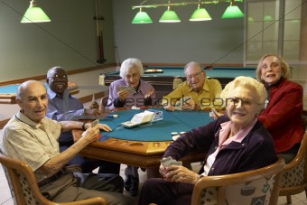 Senior adults playing bridge