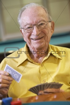 Senior man playing bridge