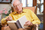 Senior man reading book