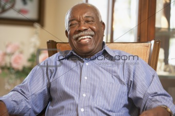 Senior man relaxing in armchair