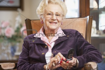 Senior woman text messaging