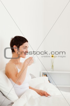 Good looking woman drinking coffee