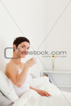Good looking woman drinking tea