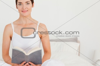 Lovely woman holding a book