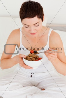 Lovely woman eating her cereal