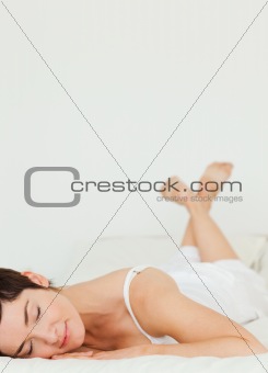 Portrait of a woman lying on her belly
