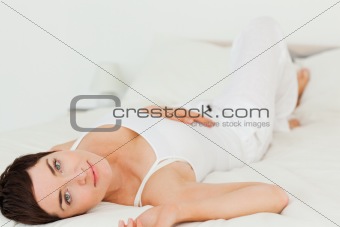 Cute woman lying on her back