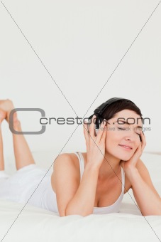 Portrait of a brunette listening to music