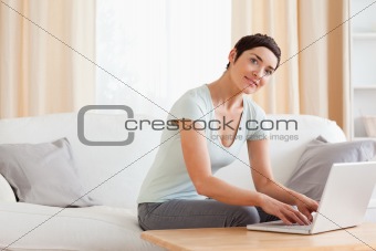 Cute woman working with a laptop