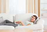 Woman relaxing with a laptop
