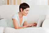 Happy short-haired woman using a laptop