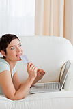 Portrait of a pensive woman buying online
