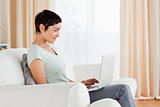 Short-haired woman working with a laptop
