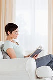 Portrait of a short-haired woman reading a book