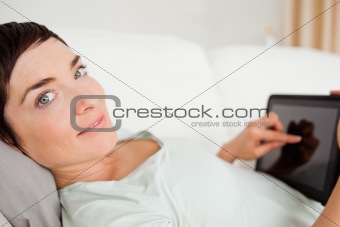 Smiling woman using a tablet computer