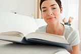 Close up of a short-haired woman reading a book