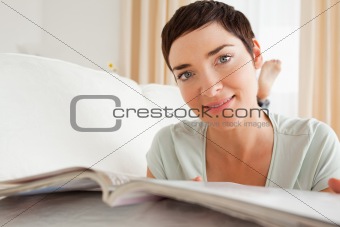 Close up of a woman with a magazine