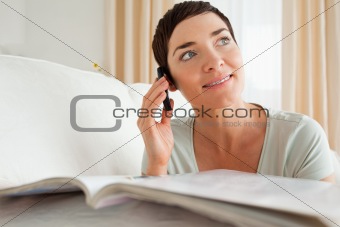 Woman with a magazine calling
