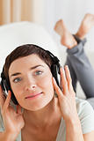 Portrait of a brunette listening to music