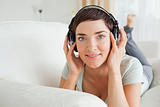 Short-haired brunette listening to music