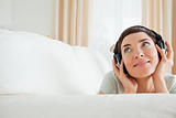 Cute short-haired woman listening to music