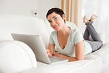 Smiling short-haired woman with a laptop