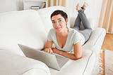 Dark-haired woman with a laptop